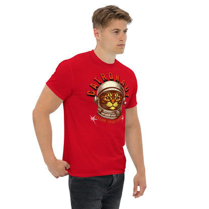 Man wearing red "Catronauts: Feline Space Medal" T-shirt by Technium Foundry, featuring a cat in a space helmet design.