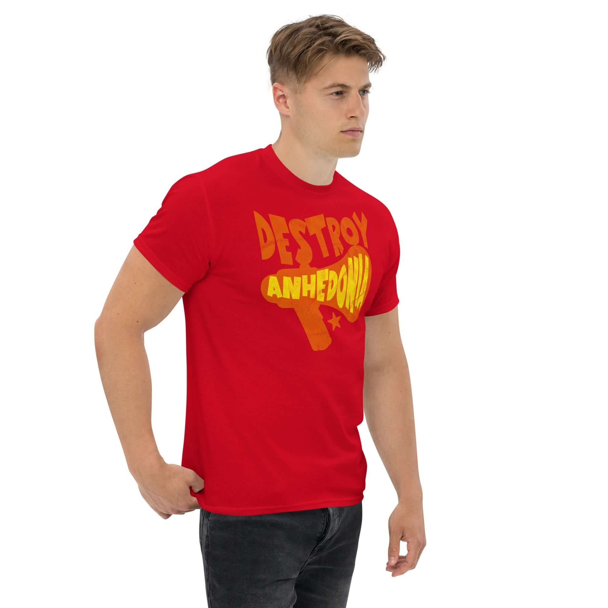 Man wearing "Destroy Anhedonia" t-shirt, promoting mental health activism with a bold punk design in red and yellow.