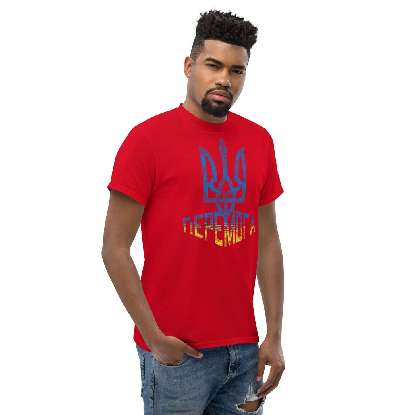 Red T-shirt featuring Ukraine's Tryzub symbol and "ПЕРЕМОГА" for Ukrainian solidarity. Casual wear supporting Ukraine.