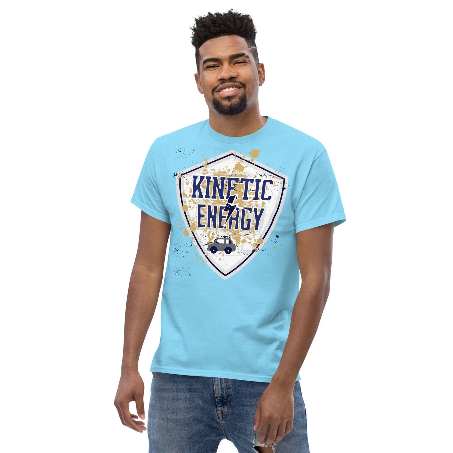 Man wearing a blue Kinetic Energy T-shirt with a distressed shield design and car icon, celebrating physics and energy with text "Kinetic Energy."