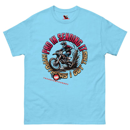 Light blue "PhD in Sending It" T-shirt featuring a dirt bike rider design by Technium Foundry, ideal for science geeks and thrill-seekers.