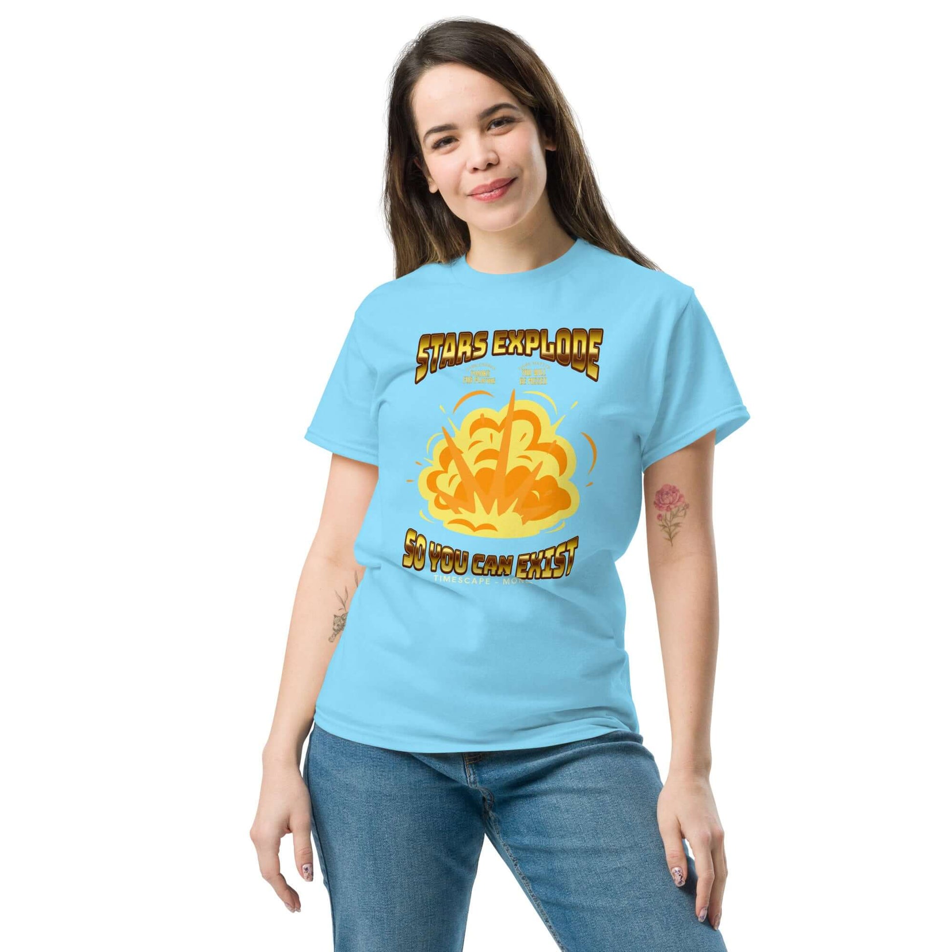 Woman wearing "Stars Explode So You Can Exist" T-shirt, featuring cosmic-themed graphic. Fun quantum apparel for science geeks.