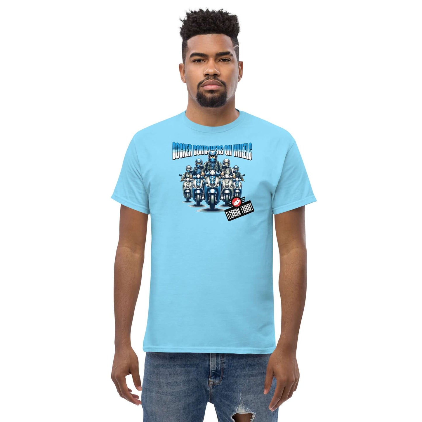 Man wearing a blue Docker Containers on Wheels T-Shirt by Technium Foundry, featuring container orchestration design.