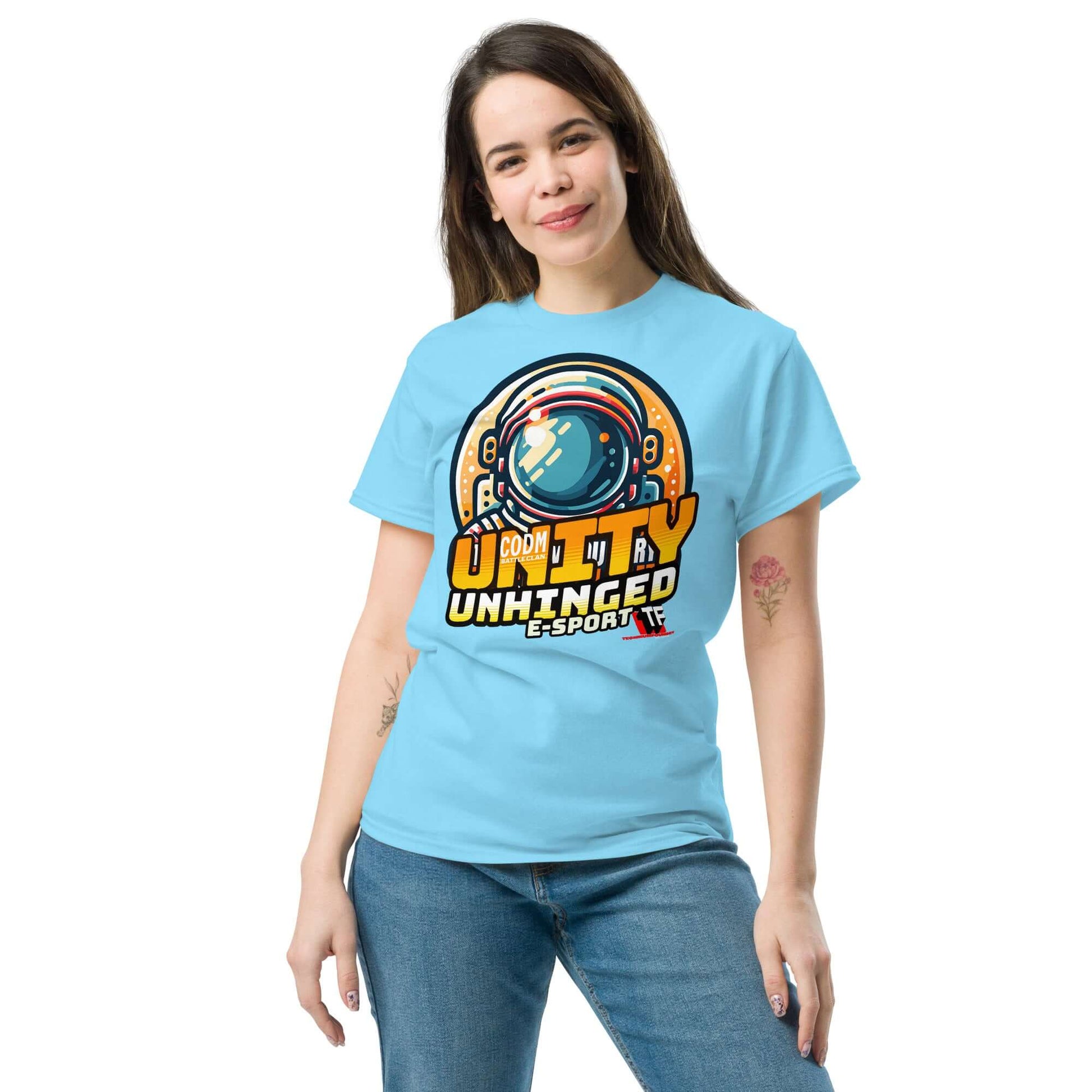 Woman wearing blue UNITY UNHINGED E-Sports T-shirt by Technium Foundry, featuring a retro-style astronaut design.