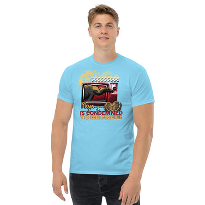 Man wearing blue T-shirt with vintage TV design, crow graphic, and quote "Man is Condemned to be Free" by Technium Foundry.