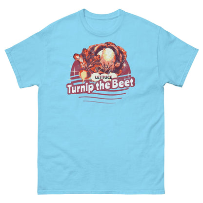 Turquoise t-shirt with "Lettuce Turnip the Beet" pun design, featuring illustrated vegetables against a vintage sunset backdrop.