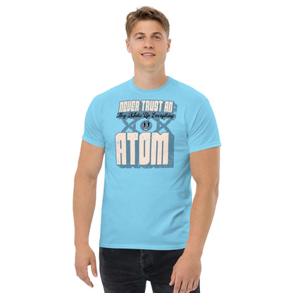 Man wearing light blue Never Trust an Atom T-shirt with science pun and retro typography.