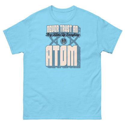 Light blue T-shirt with 'Never Trust an Atom, They Make Up Everything' science pun design featuring retro typography.