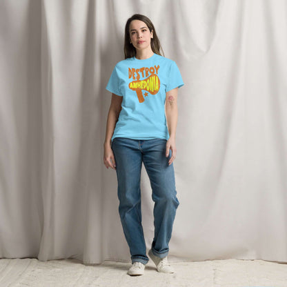 Model wearing 'Destroy Anhedonia' t-shirt, mental health activism with punk attitude, blue shirt with graphic megaphone design.