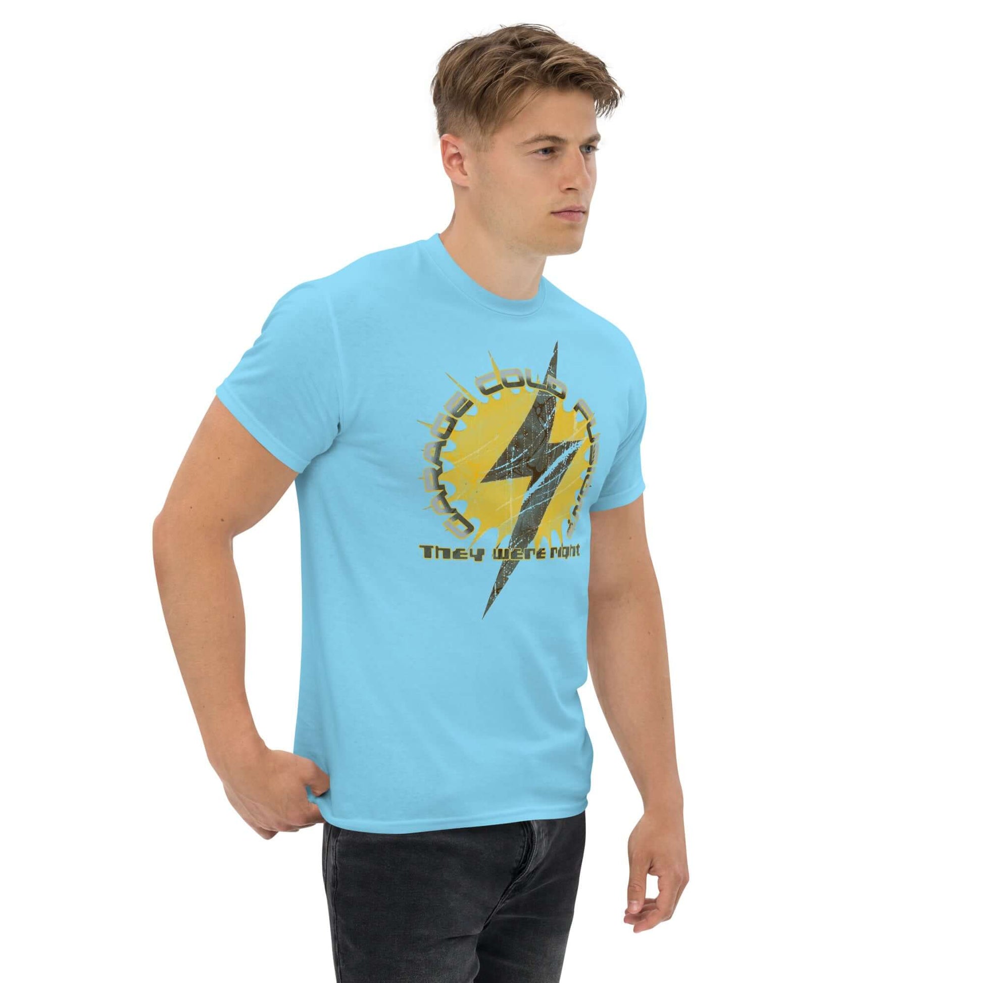 Man wearing blue Garage Cold Fusion T-Shirt with lightning bolt and gear design, featuring humorous "They Were Right" slogan.