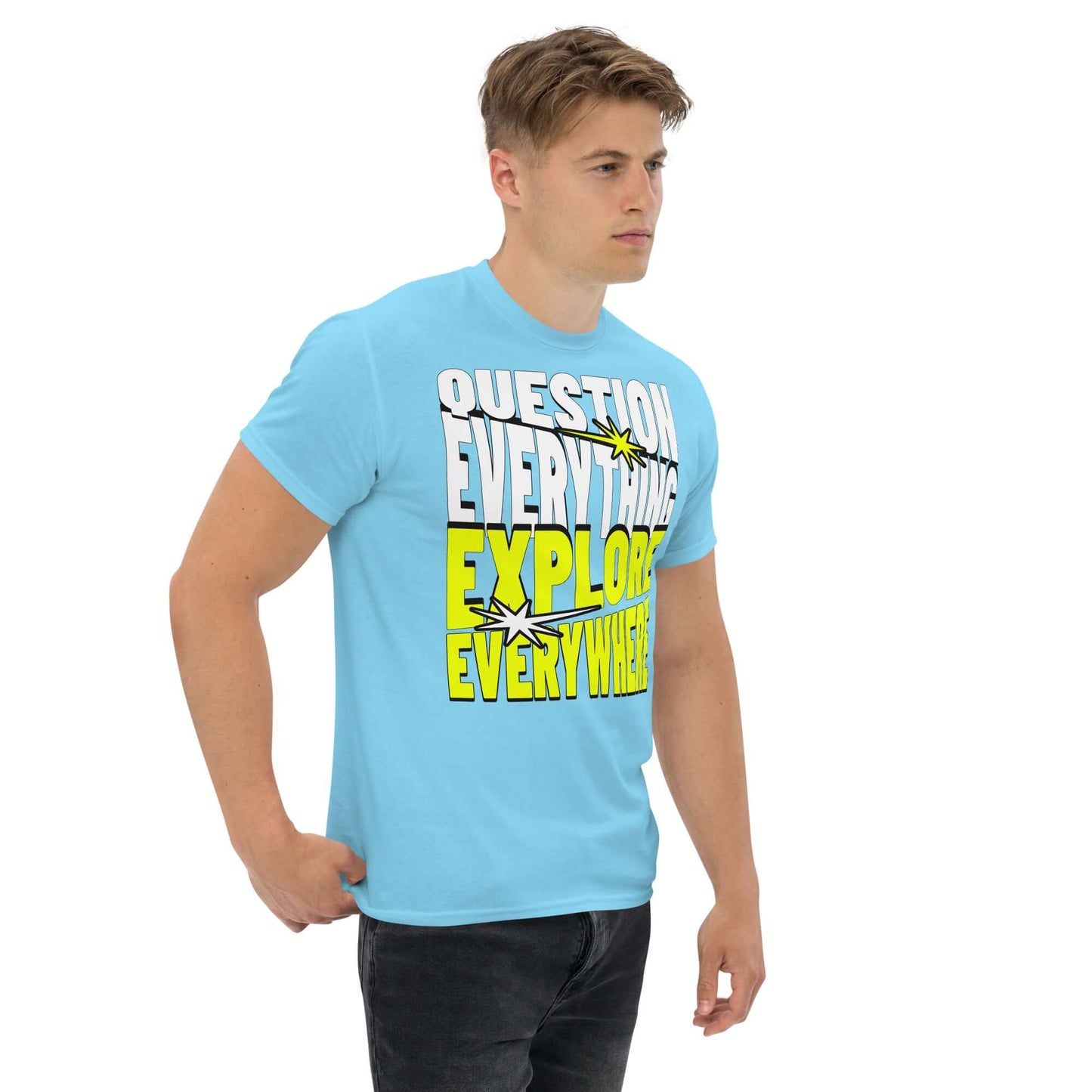 Adventure Tee with "Question Everything Explore Everywhere" slogan in white and yellow text on a blue t-shirt.