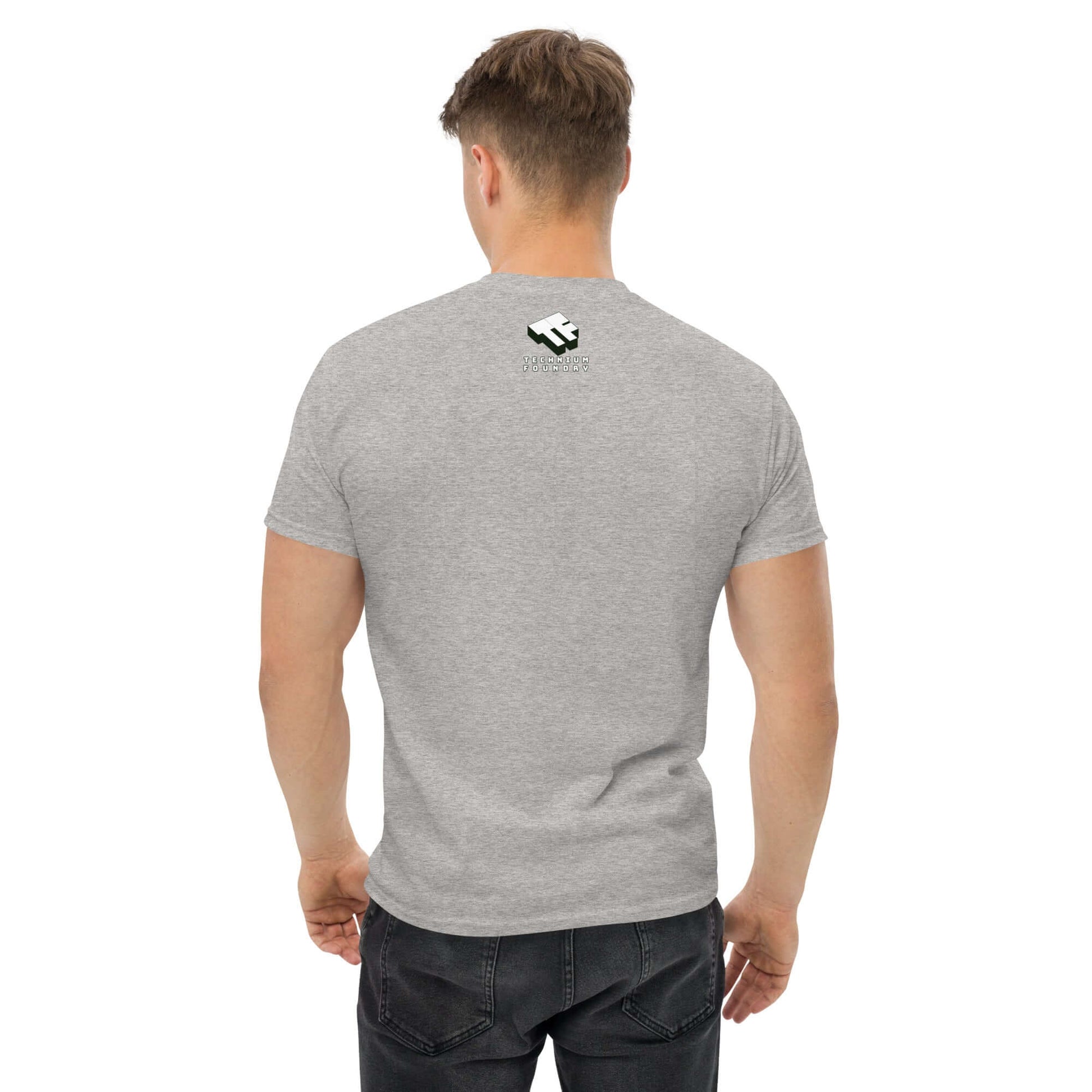 Man wearing a gray t-shirt with a small logo on the back, rear view.