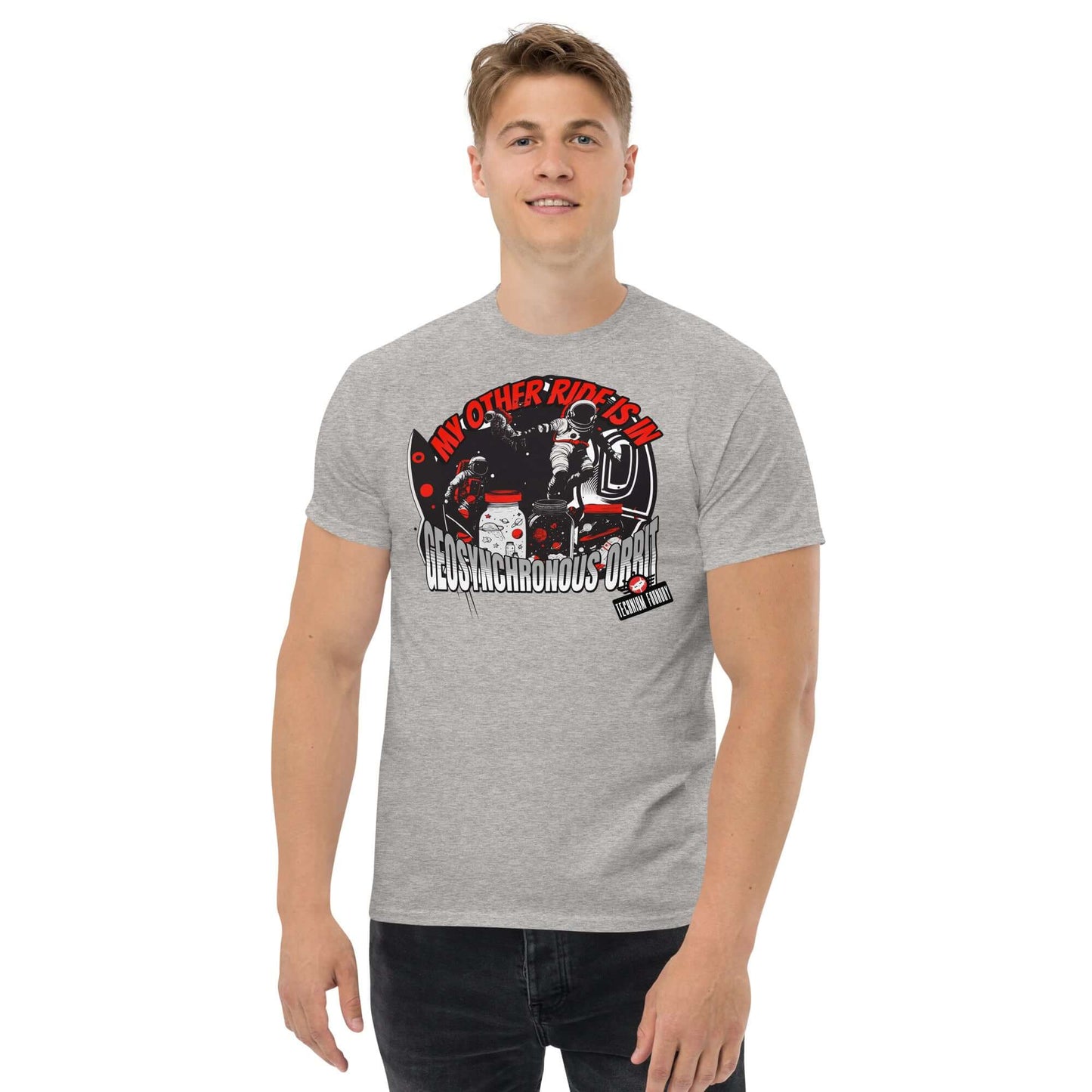 Man wearing a "My Other Ride is in Geosynchronous Orbit" gray T-shirt with astronaut graphic by Technium Foundry.