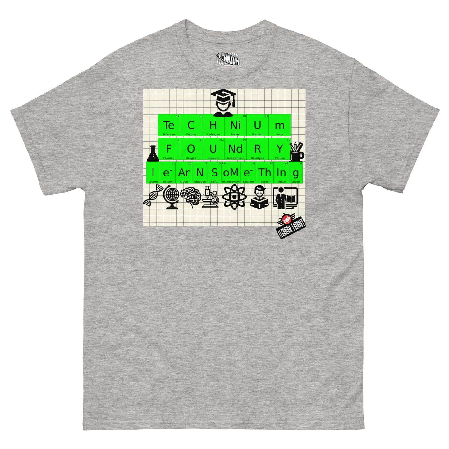 Technium Foundry T-Shirt with periodic table elements forming "TECHNIUM FOUNDRY" and "LEARN SOMETHING" on graph paper, science icons included.