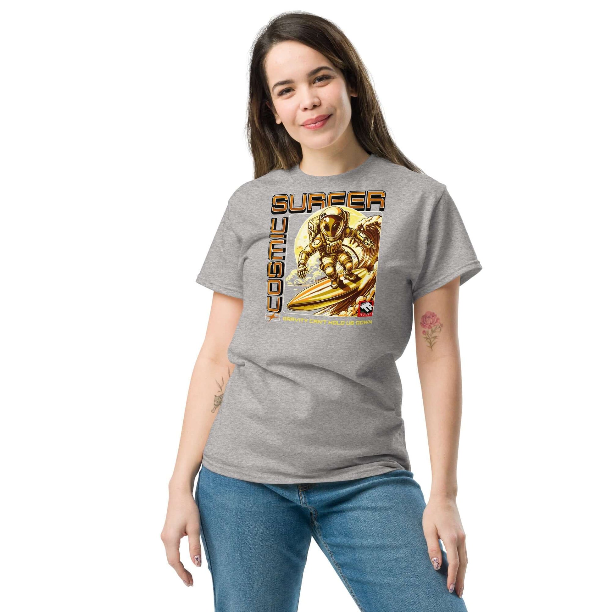 Woman wearing a Cosmic Surfer T-Shirt by Technium Foundry with retro-tech gold astronaut surfing design.