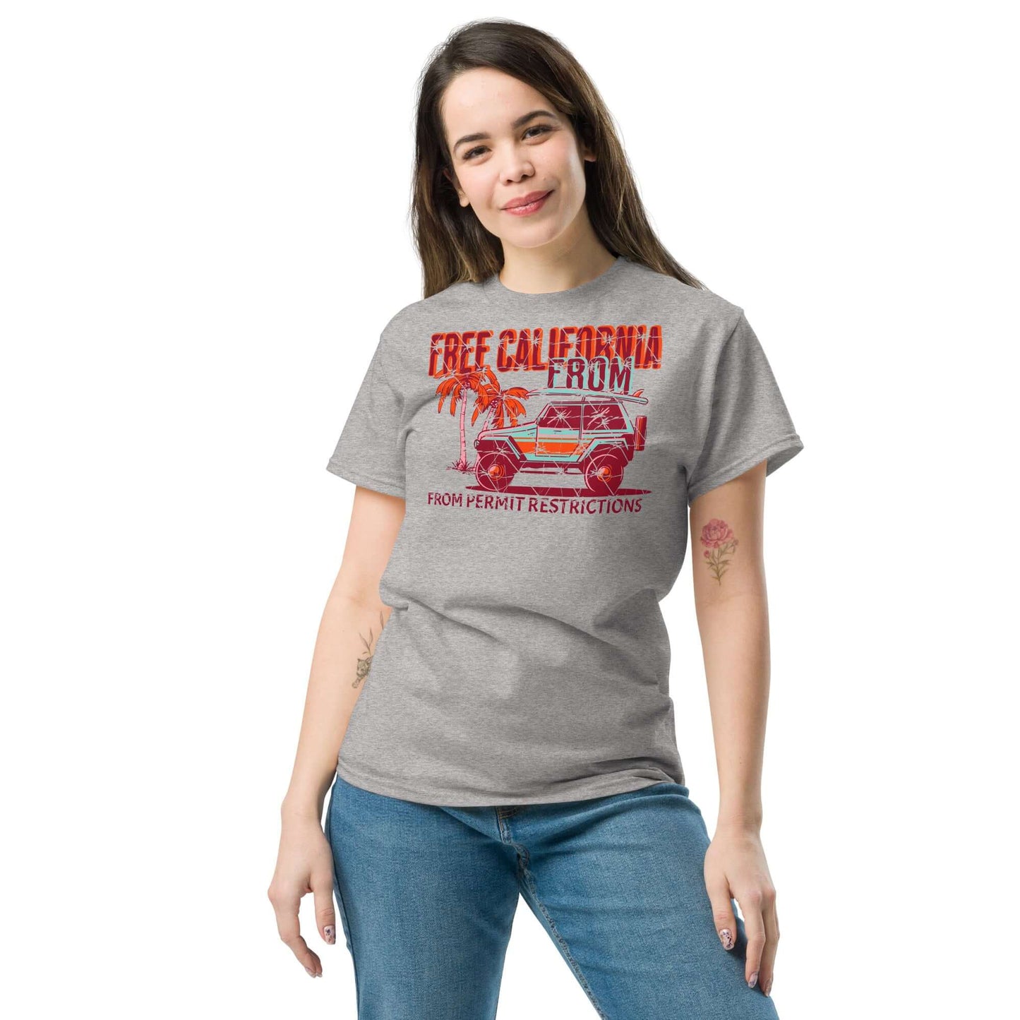 Woman wearing Free California Surf T-Shirt with beach 4x4 and palm tree design, perfect for surfers who love adventure and style.