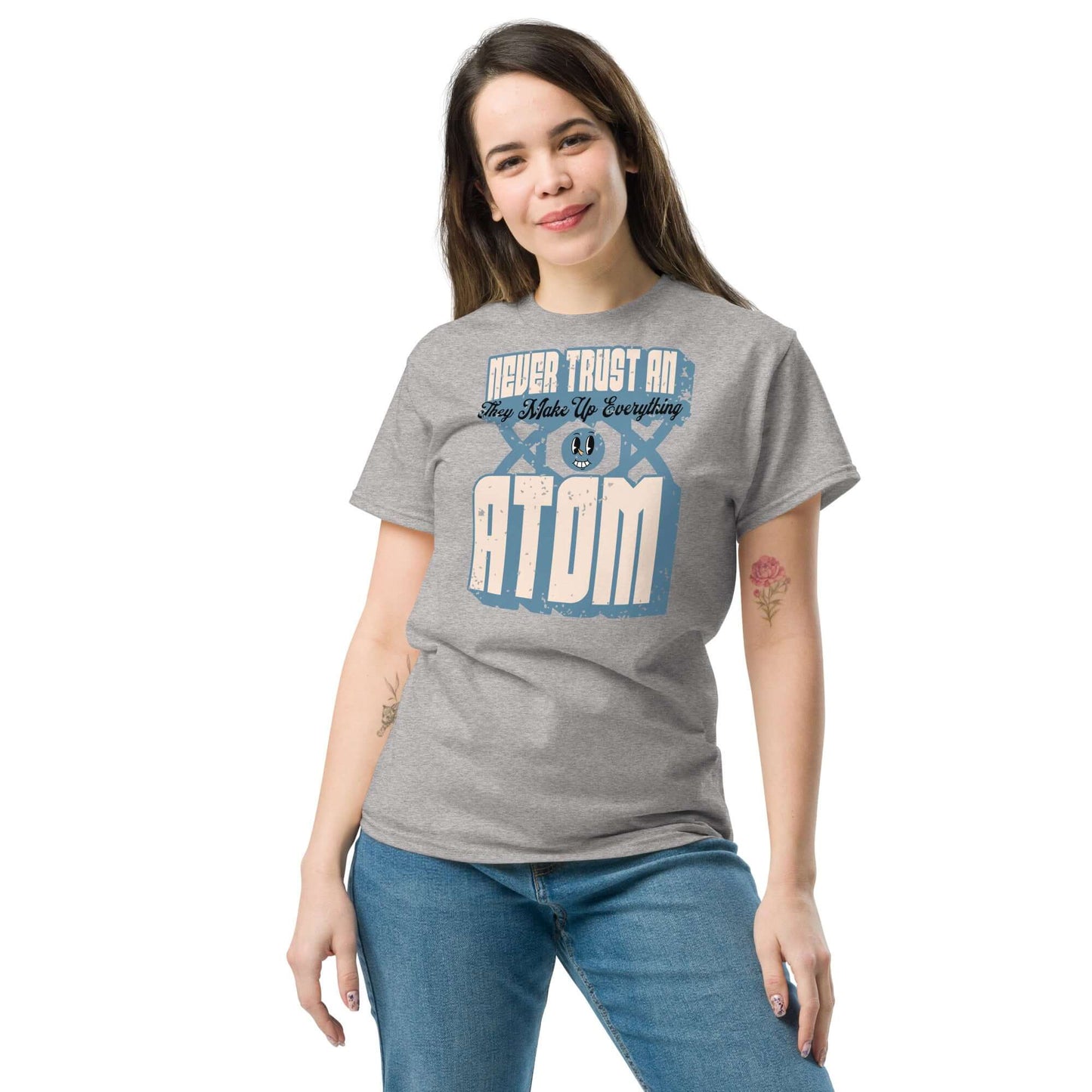 Woman wearing a 'Never Trust an Atom' science pun T-shirt with retro typography, perfect for science enthusiasts and humor lovers.