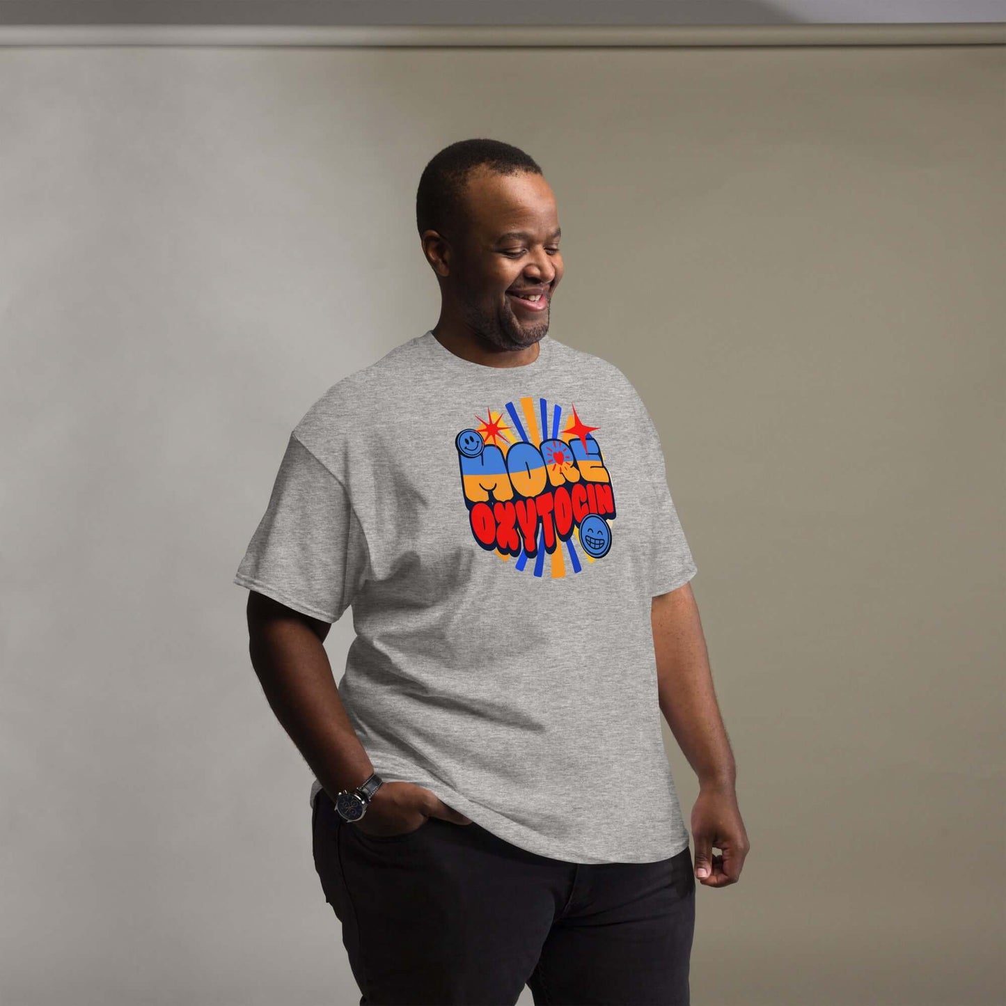 Smiling person wearing a gray 'More Oxytocin' t-shirt with groovy retro design promoting love hormone.