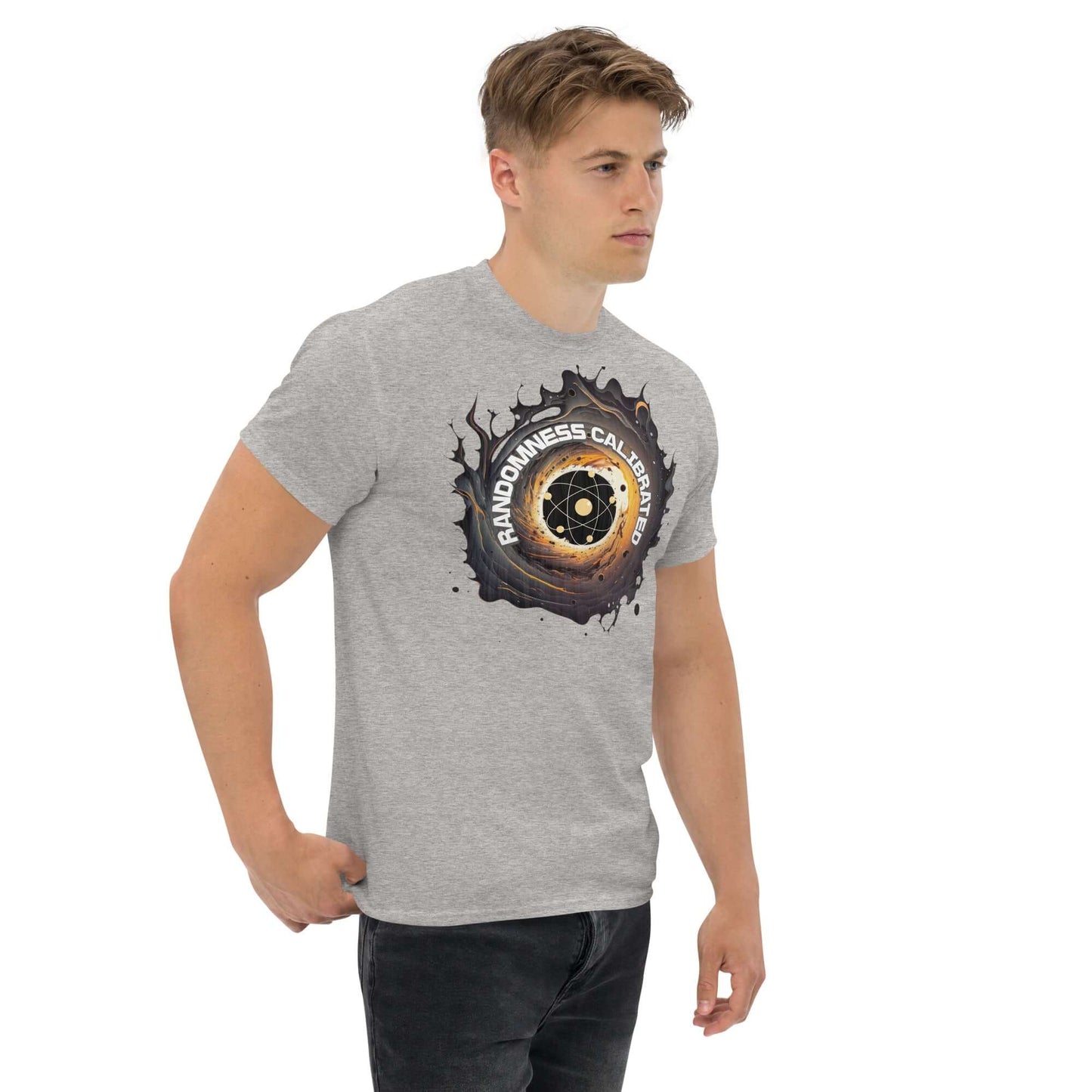 Man wearing Quantum Physics T-shirt featuring atomic symbol with "RANDOMNESS CALIBRATED" text, blending science and humor.