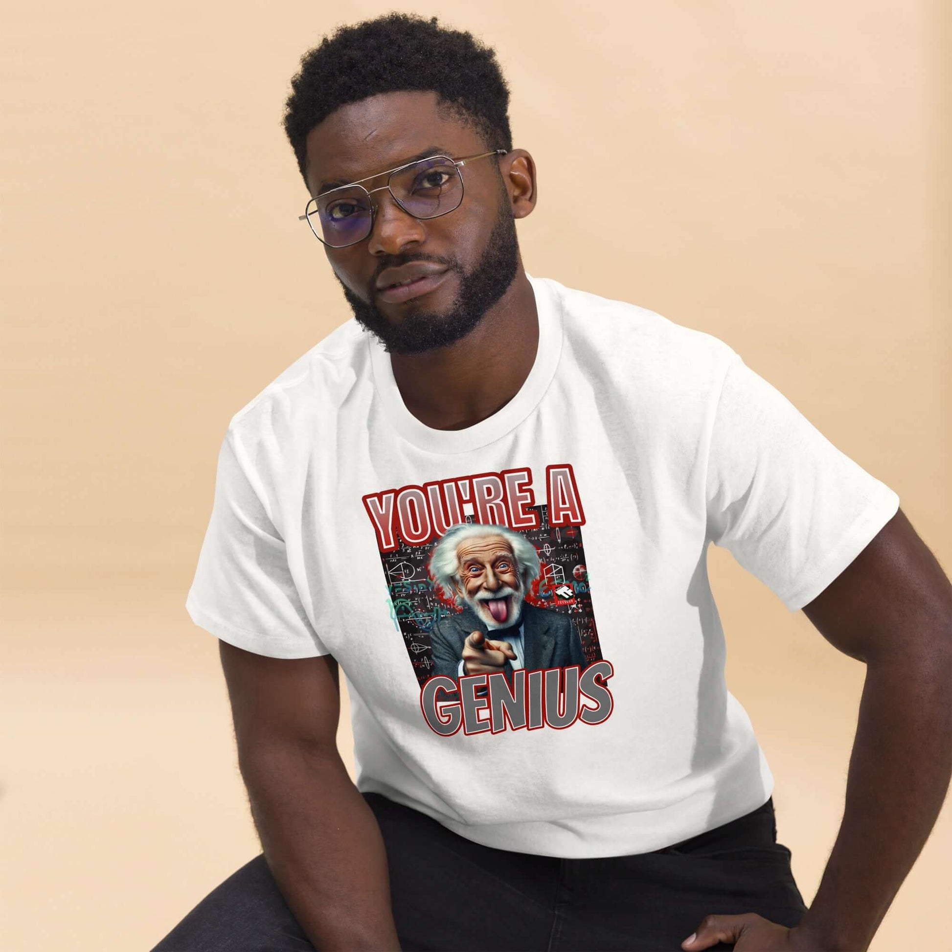 Man wearing "You're A Genius" T-shirt featuring Einstein's playful expression and chalkboard equations, by Technium Foundry.