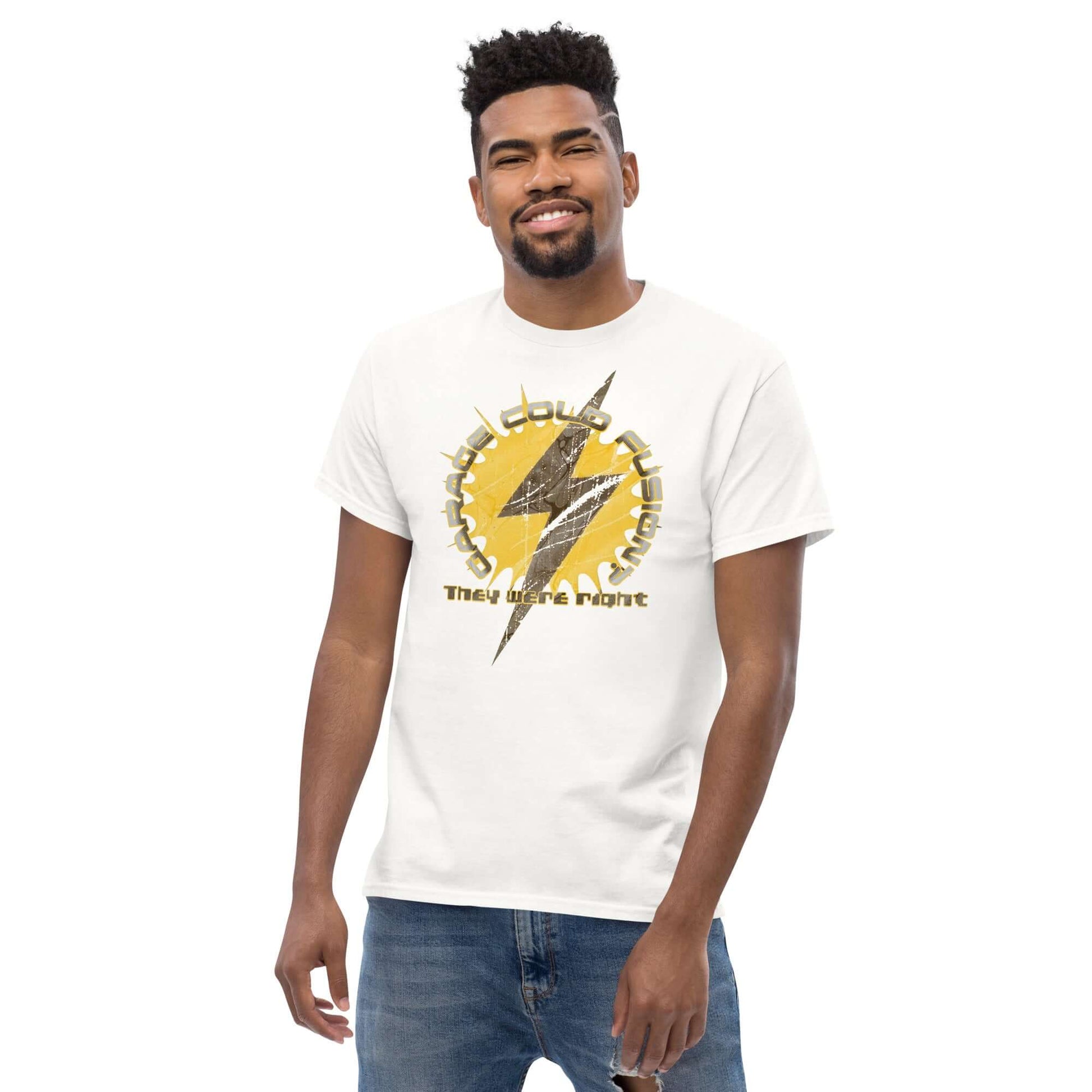 Man wearing Garage Cold Fusion T-Shirt with a lightning bolt and gear design, featuring humorous text about a science experiment.