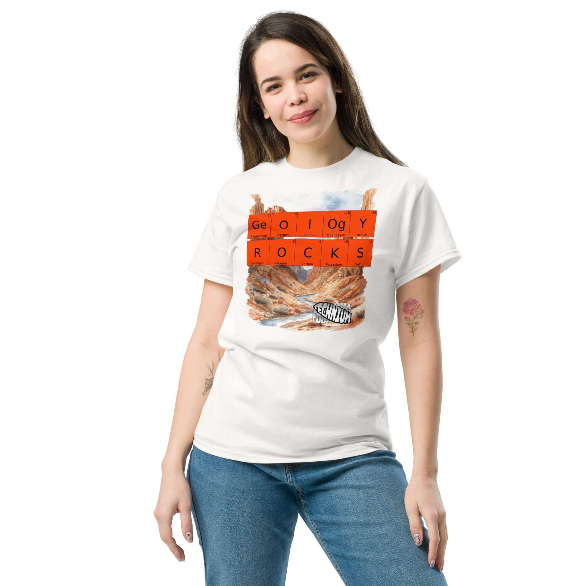 Woman wearing "GEOLOGY ROCKS" T-shirt by Technium Foundry, featuring a geology pun with periodic elements and a landscape design.