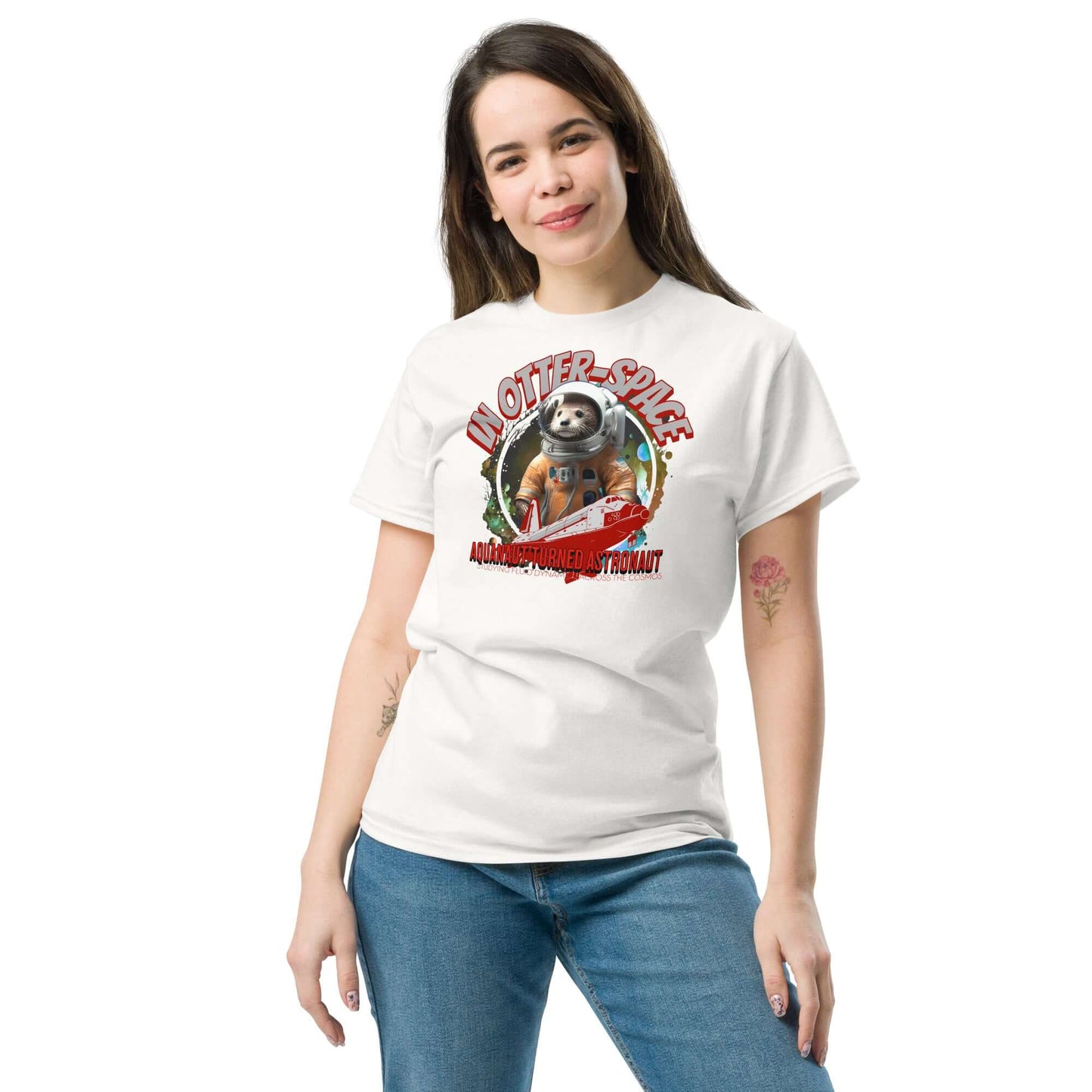 Woman wearing "In Otter Space: Aquanaut Turned Astronaut" t-shirt with otter astronaut design, cosmic background, and orange spacesuit.