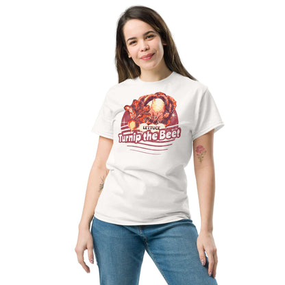 Person wearing 'Lettuce Turnip the Beet' T-shirt with vegetable pun design, featuring a sunset backdrop.