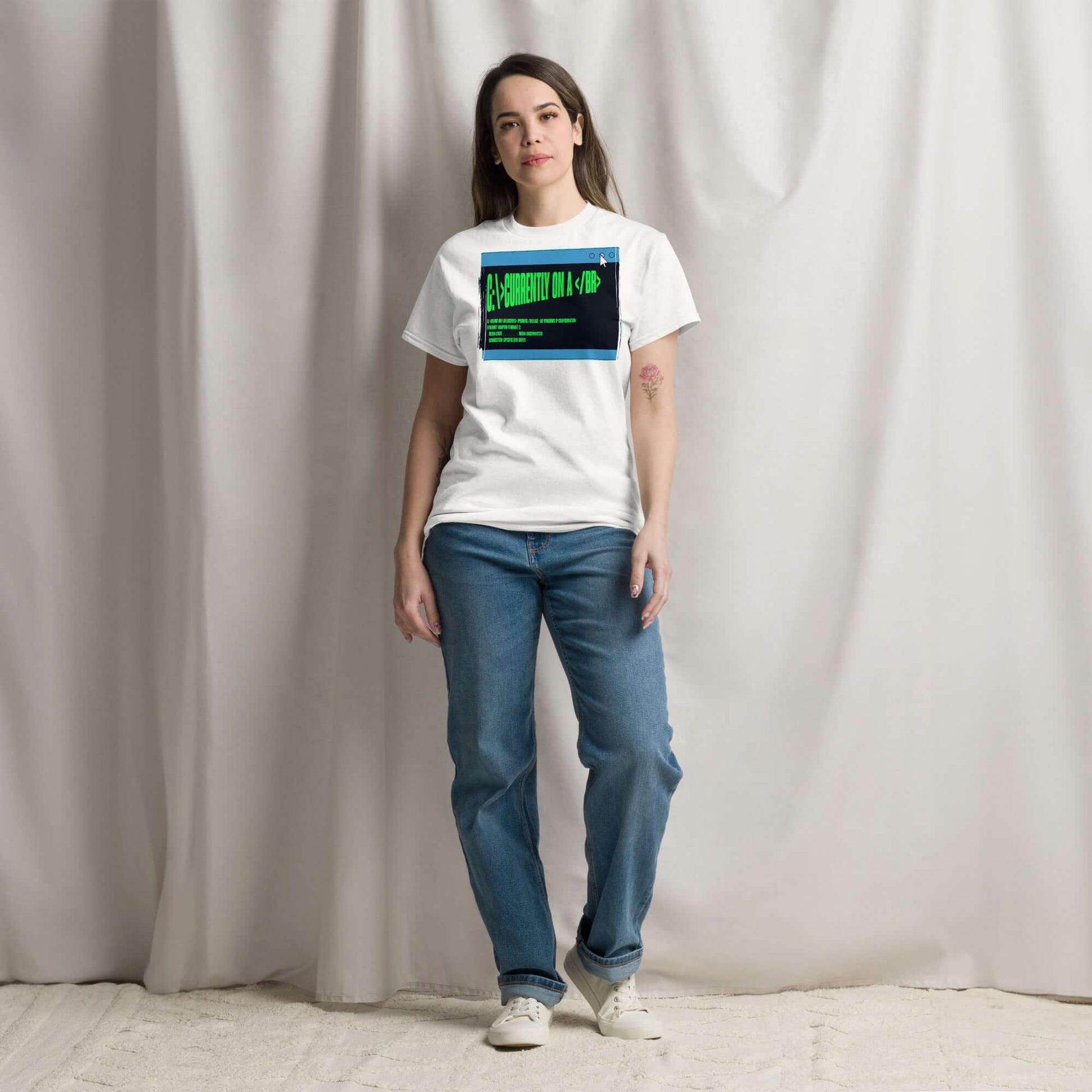 Woman wearing a "Currently On a <br>" HTML humor T-shirt with terminal green text in a browser window design.