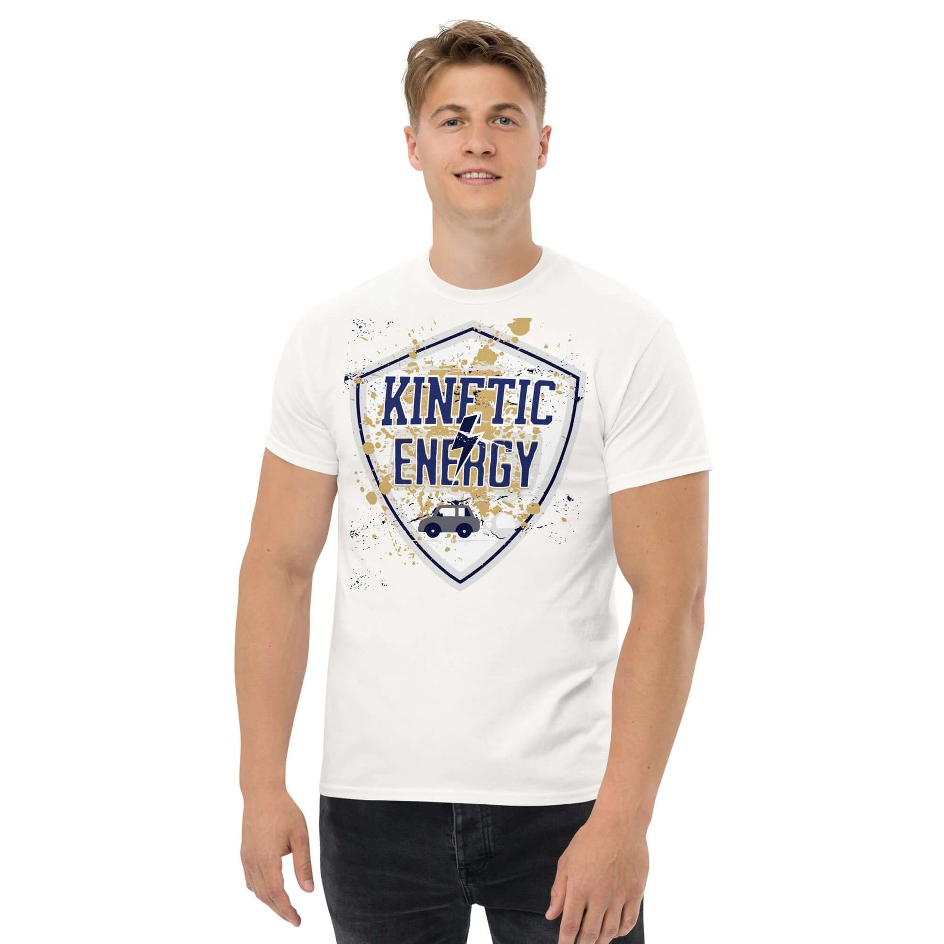 Man wearing white Kinetic Energy T-shirt with vintage shield design and car, highlighting 1/2mv² equation for physics enthusiasts.