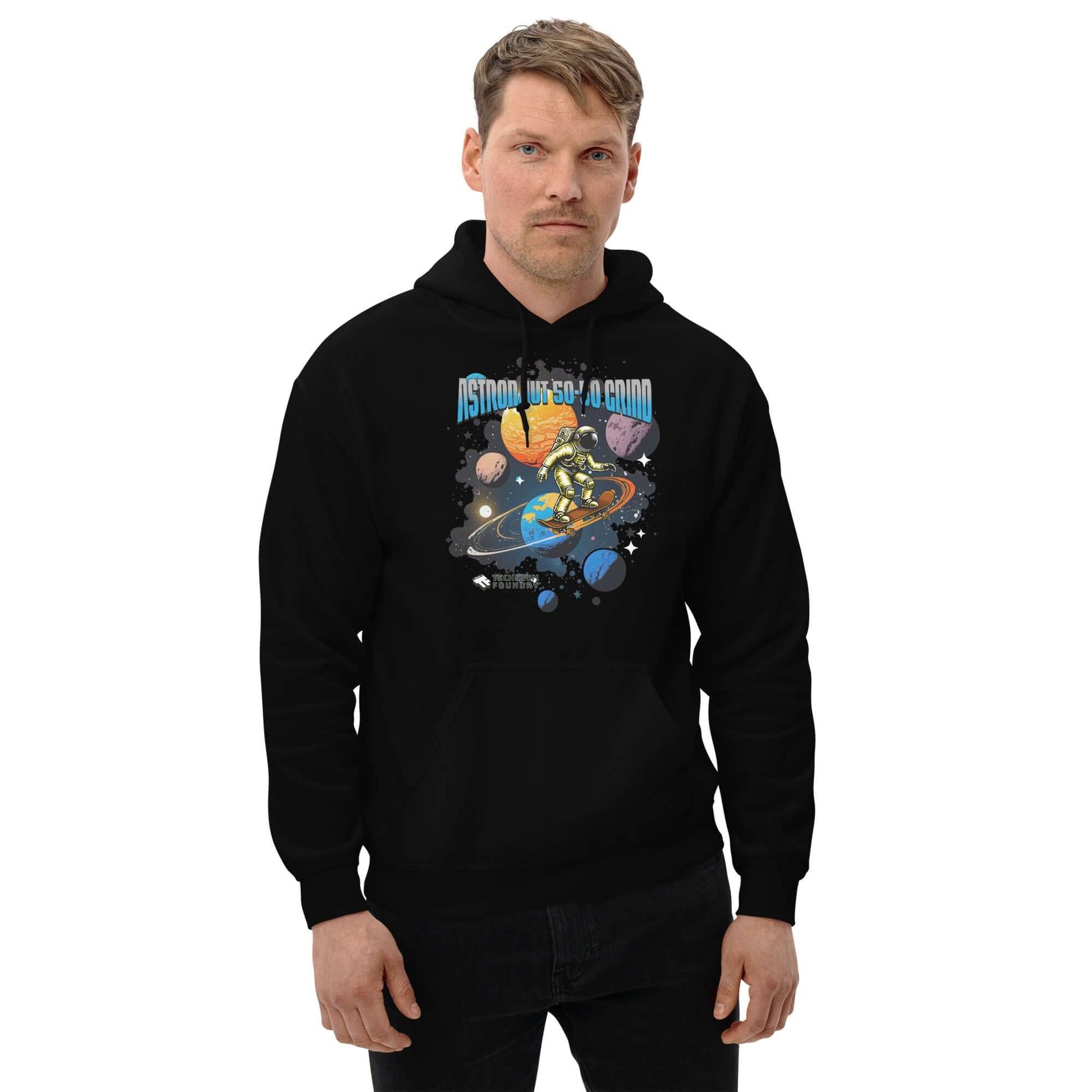 Astronaut 50-50 Grind Hoodie by Technium Foundry, featuring cosmic skater design on black hoodie, worn by model.