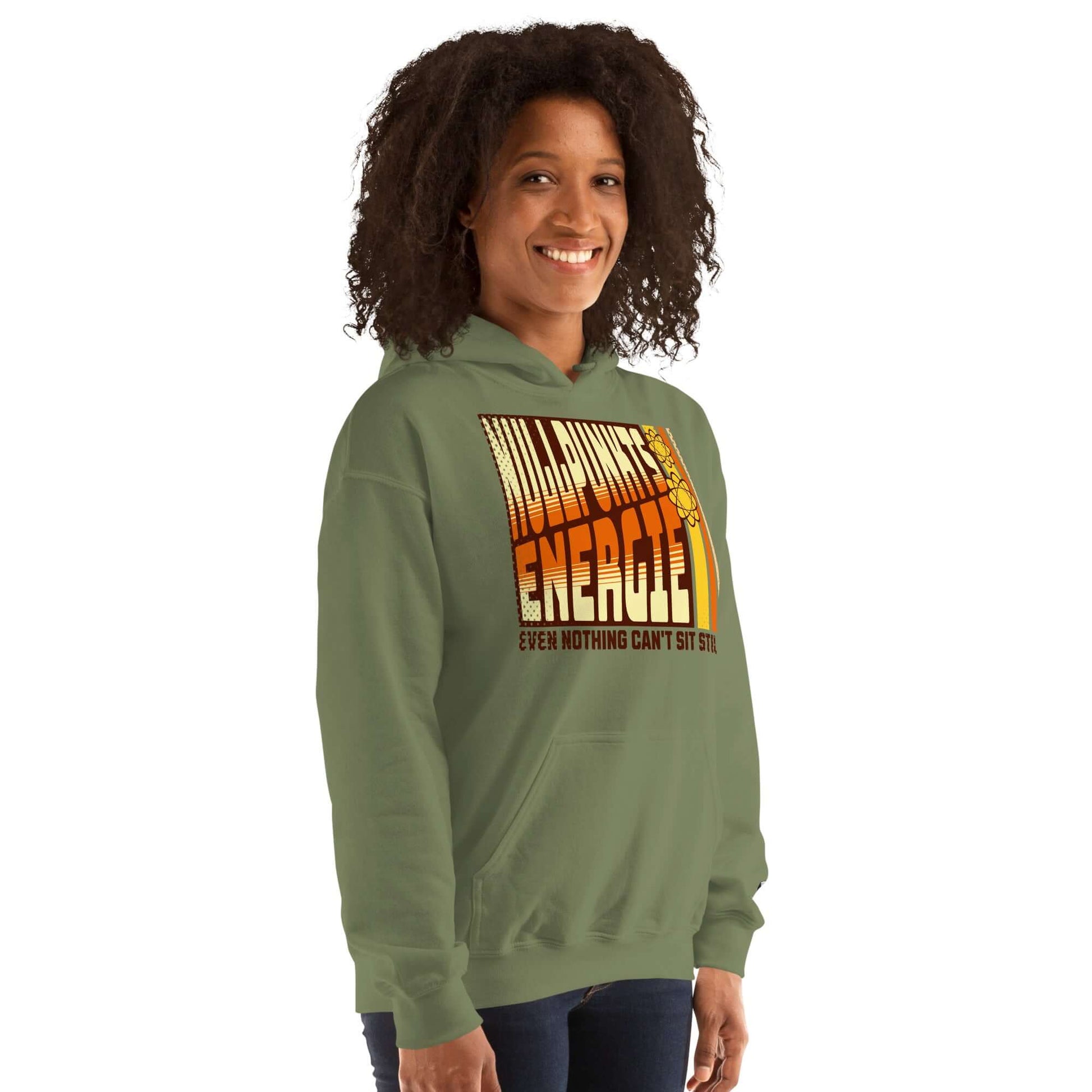 Woman wearing Nullpunktsenergie hoodie with retro-70s typography design, showcasing quantum uncertainty style in green.