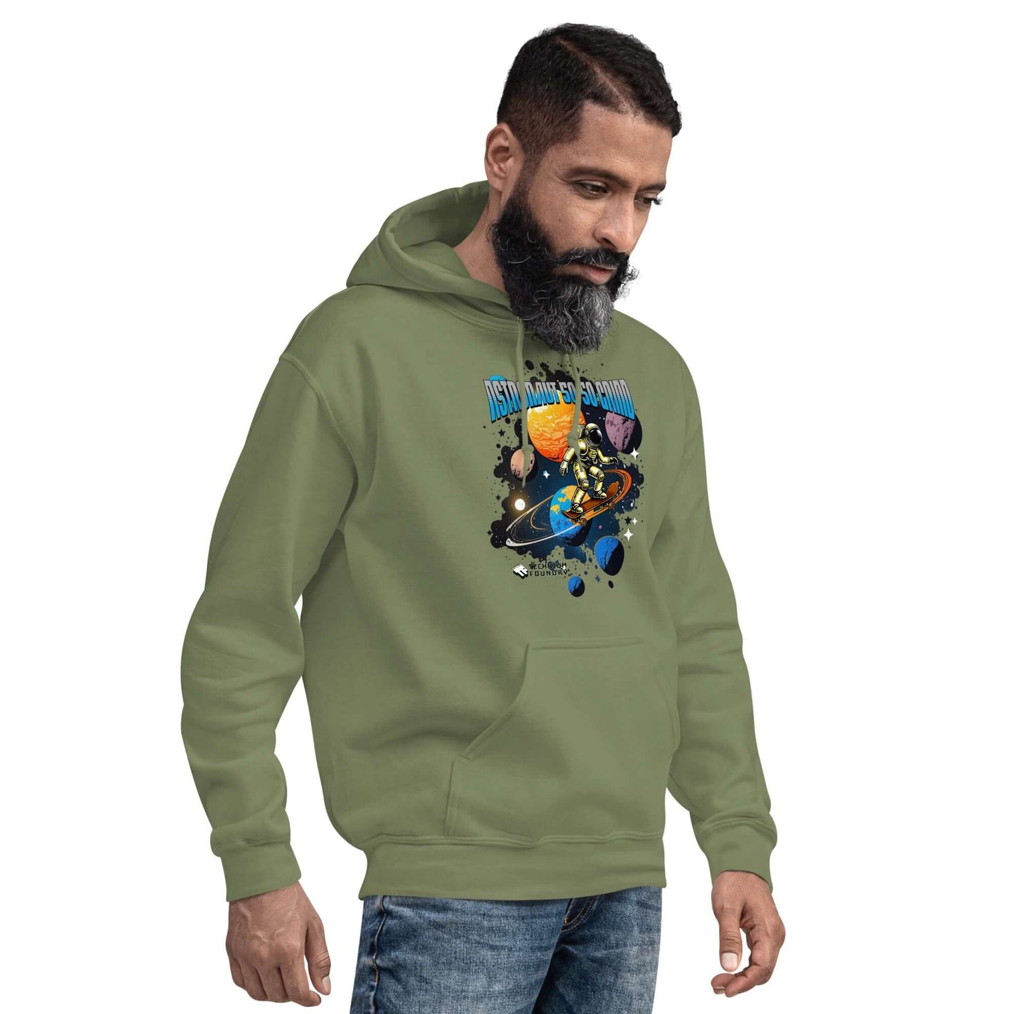 Man wearing olive green astronaut hoodie with cosmic skateboard design, showcasing Technium Foundry's space-inspired apparel.