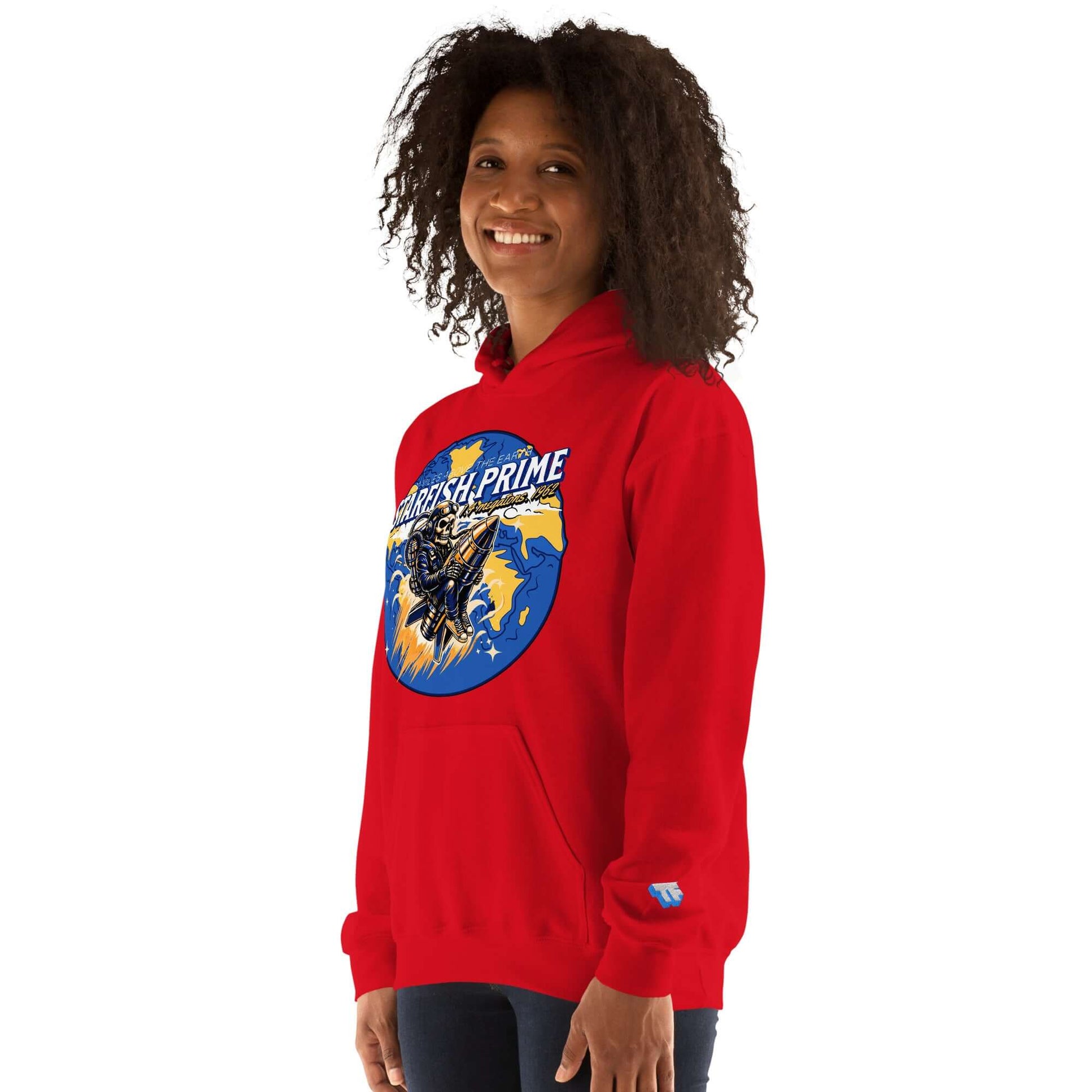 Red Starfish Prime hoodie featuring retro nuclear test design worn by a smiling person.