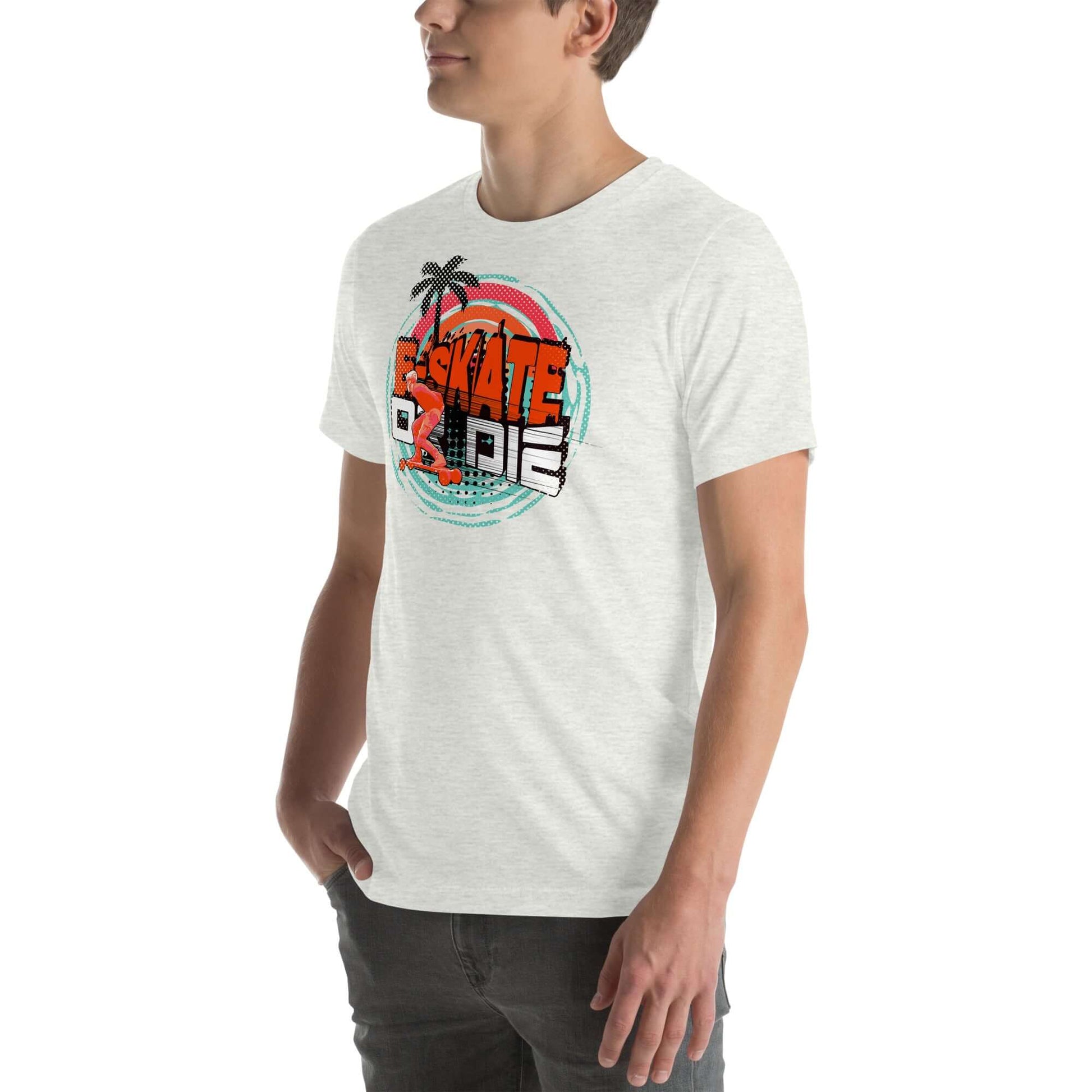 Man wearing eSkate Life T-Shirt with retro sunset and palm tree design, celebrating electric skateboarding lifestyle.