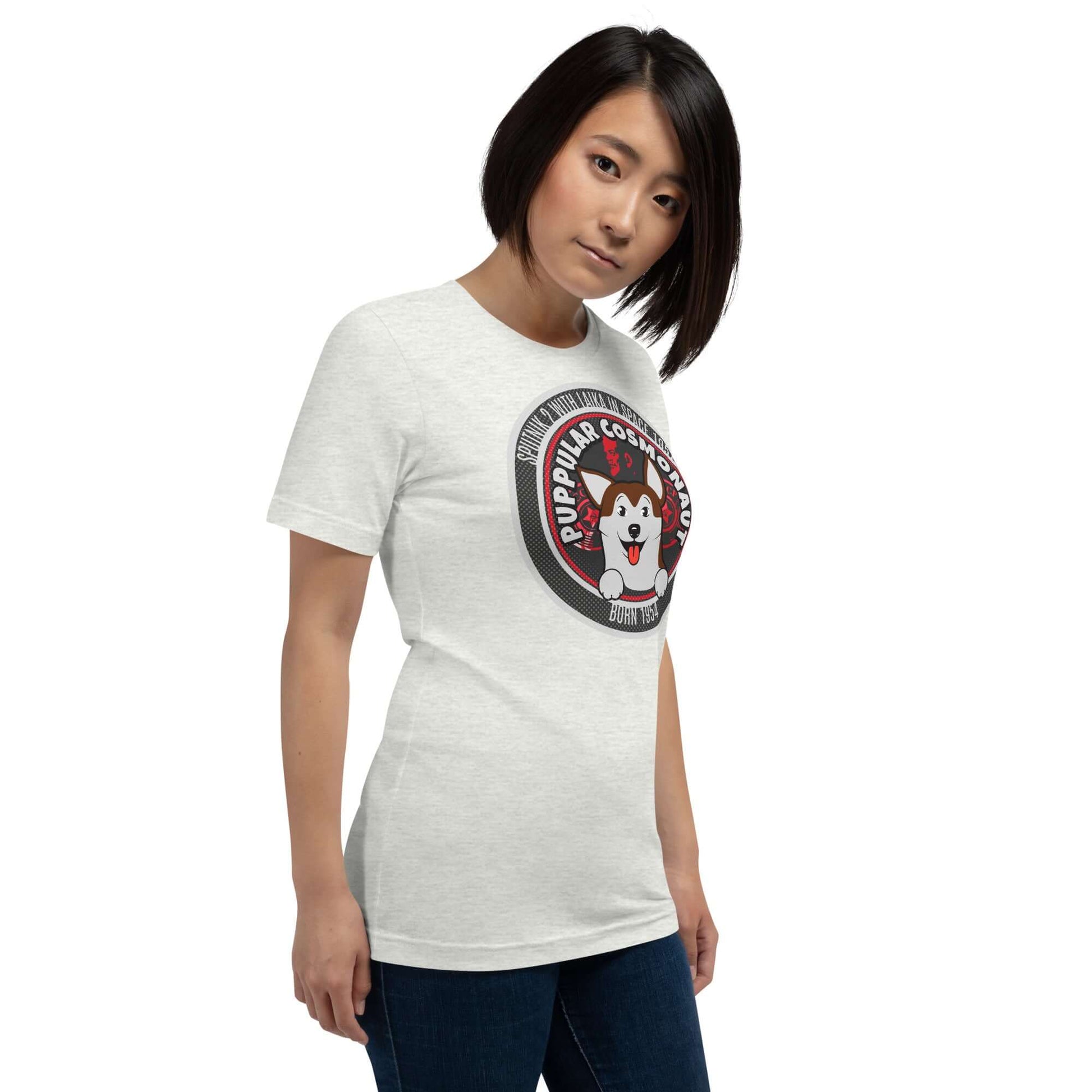 Woman wearing Puppular Cosmonaut T-Shirt with space dog Laika design, retro style emblem.