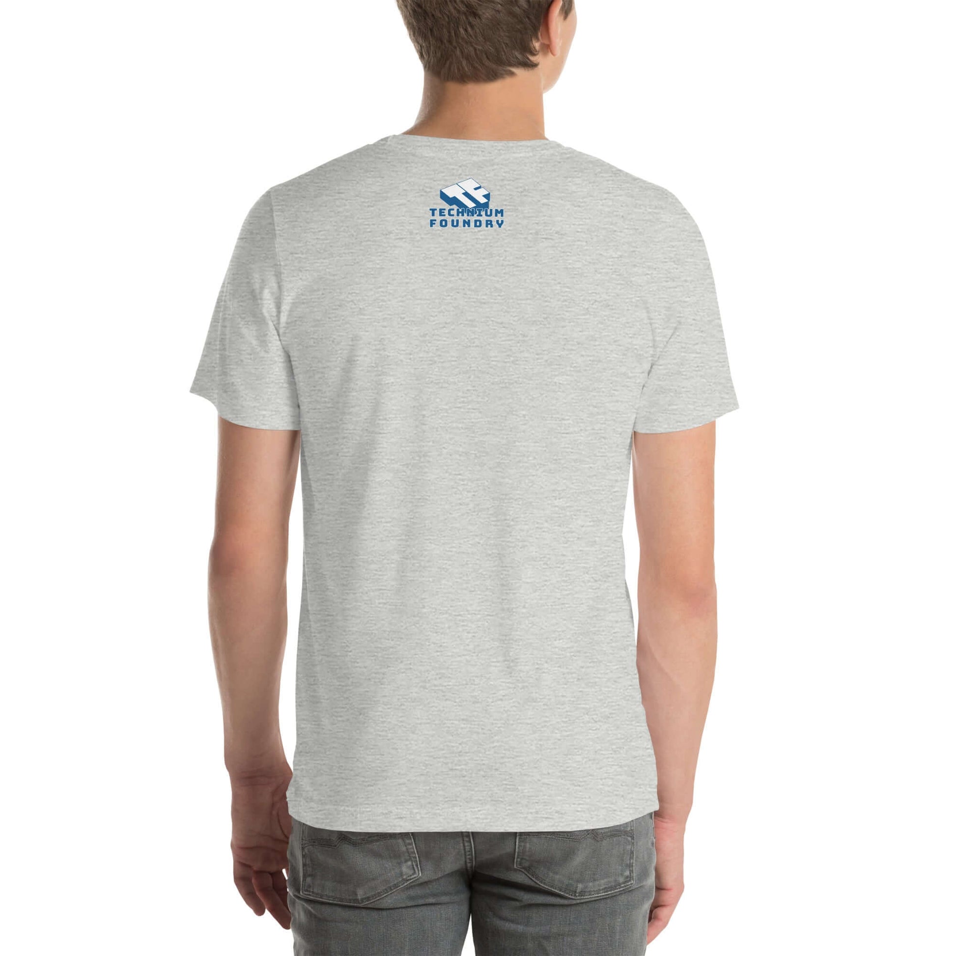 Back view of a gray t-shirt with blue "TechHum Foundry" logo on upper back, paired with jeans.