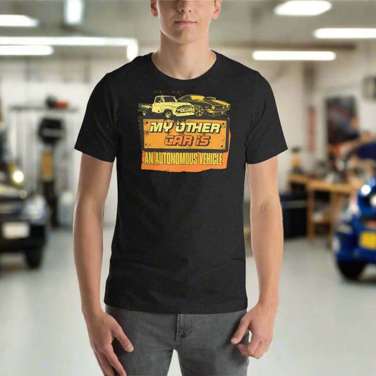 "My Other Car Is An Autonomous Vehicle T-Shirt featuring vintage car graphics in a workshop setting"