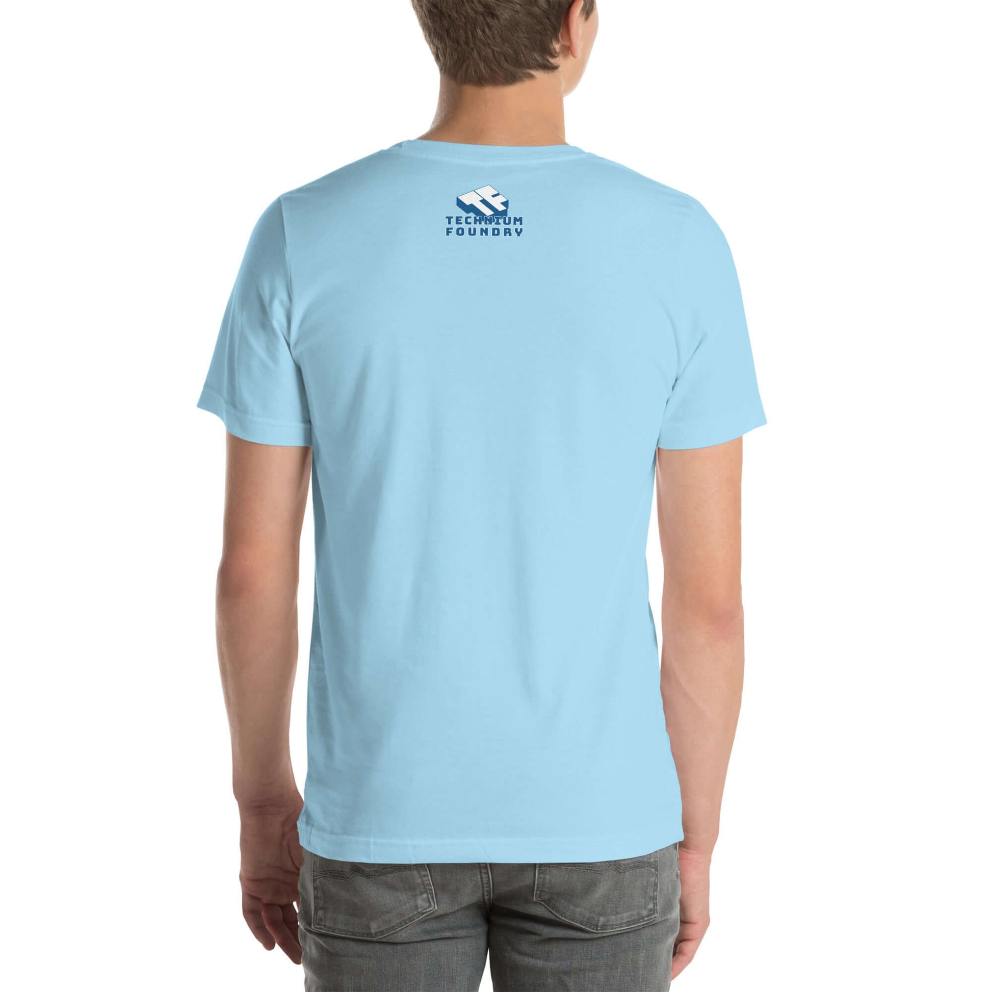 Light blue t-shirt with Technicum Foundry logo on back, worn by a person standing.