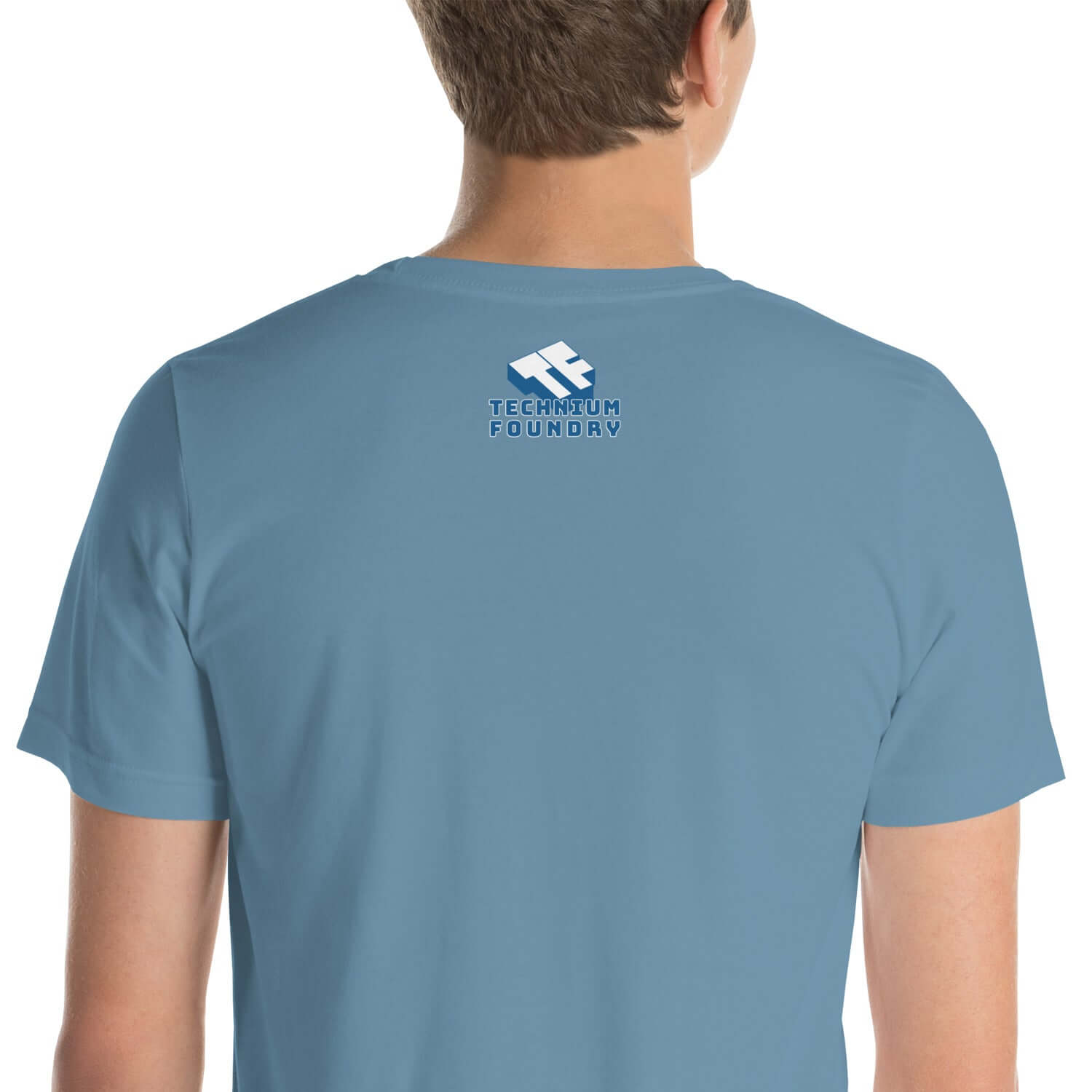 Back view of blue Technium Foundry t-shirt with logo, showcasing minimalist design and comfortable fit for modern style.