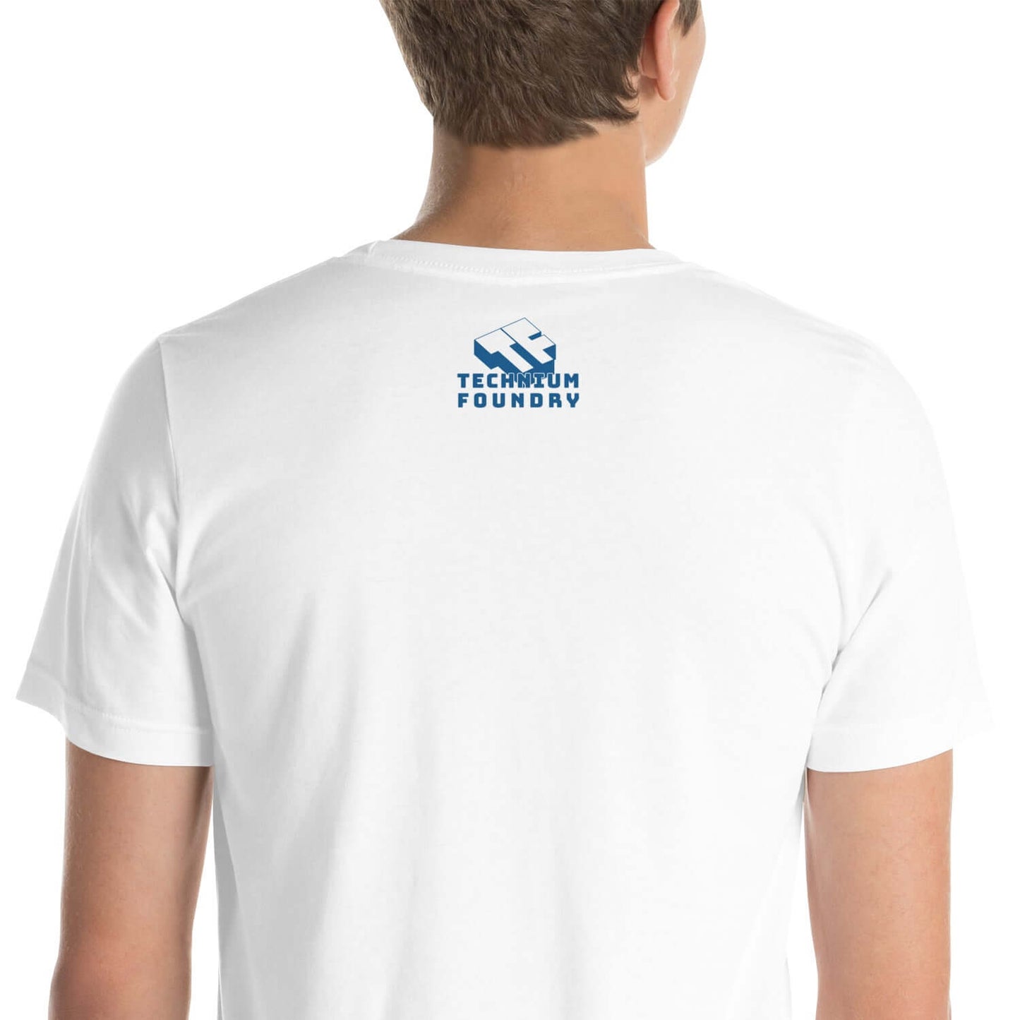 Back view of a white t-shirt with Technium Foundry blue logo on a person standing.