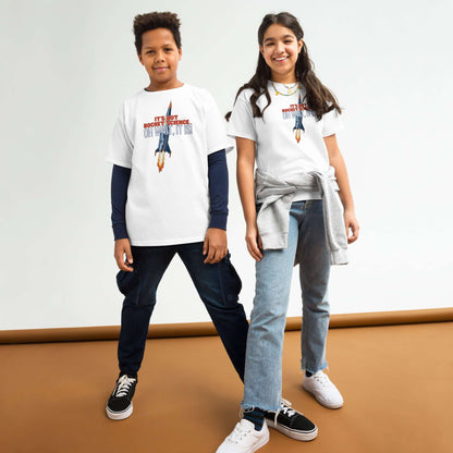 Two kids wearing "It's Not Rocket Science... Oh Wait, It Is!" tees with rocket design, expressing the fun of embracing rocket science.